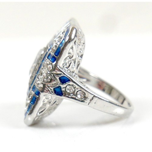 38 - An Art Deco style white metal dress ring, head size 24 by 19mm, size M.