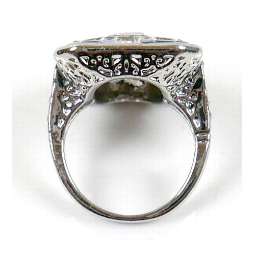 38 - An Art Deco style white metal dress ring, head size 24 by 19mm, size M.