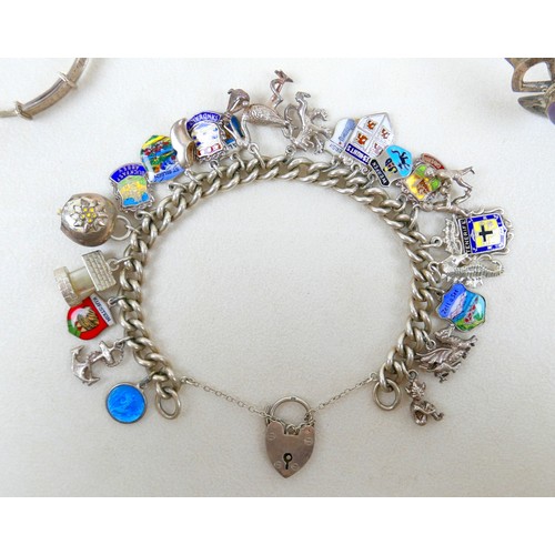 40 - A silver charm bracelet and three other silver items 98g.(4)