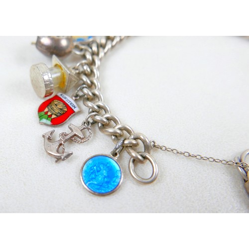 40 - A silver charm bracelet and three other silver items 98g.(4)