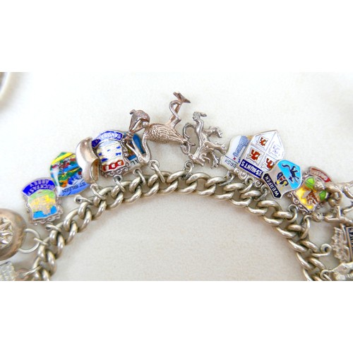 40 - A silver charm bracelet and three other silver items 98g.(4)