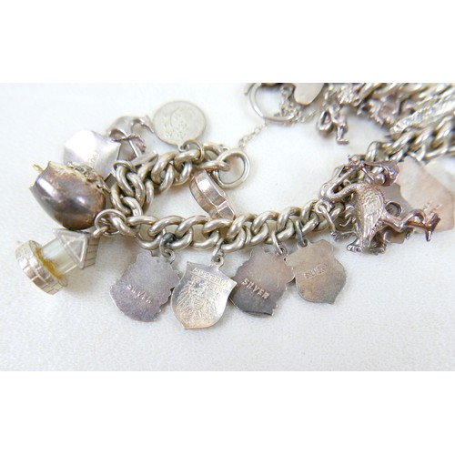 40 - A silver charm bracelet and three other silver items 98g.(4)