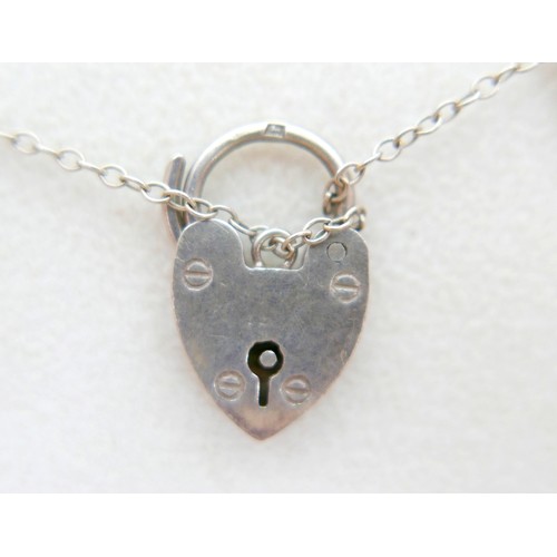 40 - A silver charm bracelet and three other silver items 98g.(4)