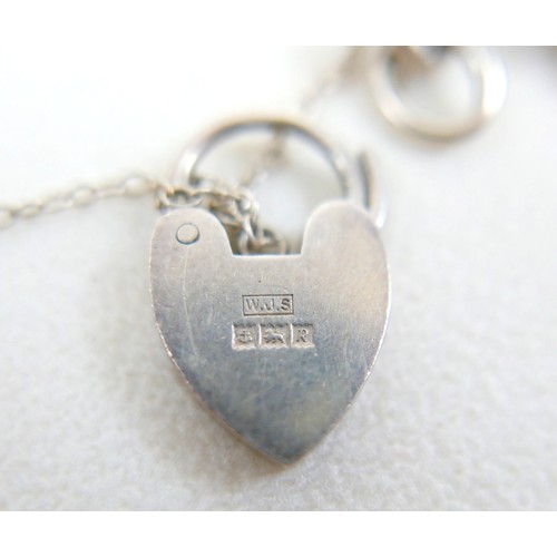 40 - A silver charm bracelet and three other silver items 98g.(4)
