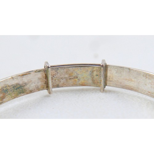 40 - A silver charm bracelet and three other silver items 98g.(4)