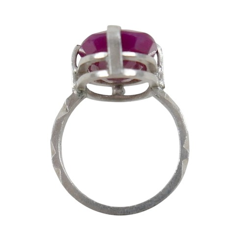 48 - A silver/white metal filled ruby single stone ring, head size 24 by 14 by 7mm, ring size Q.