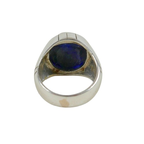 50 - A silver/white metal filled sapphire single stop ring head size 19 by 17mm, ring size R.