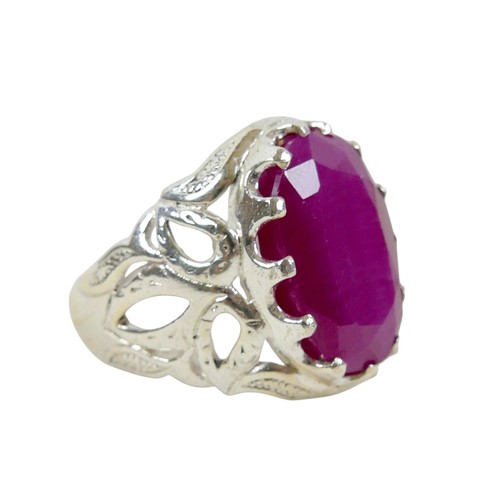 52 - A silver/white metal filled ruby single stone ring head size 23 by 16mm, ring size T.