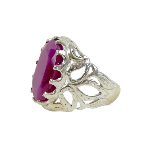 52 - A silver/white metal filled ruby single stone ring head size 23 by 16mm, ring size T.