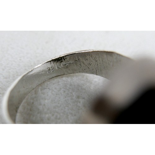 53 - A silver/white metal jade ring head size 17 by 20mm, ring size T.