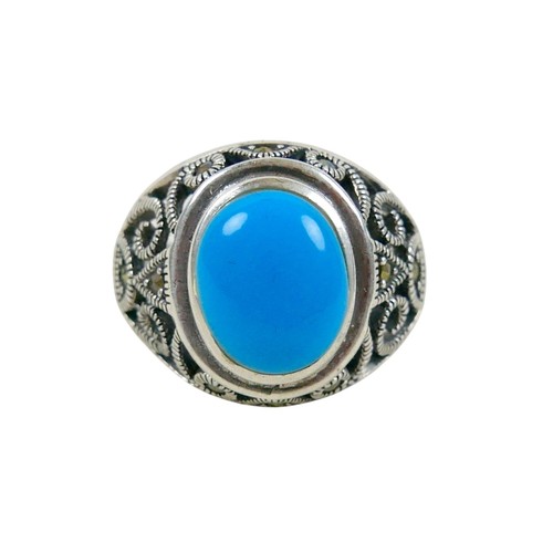 56 - A silver/white metal turquoise ring head size 13 by 16mm, ring size T.
