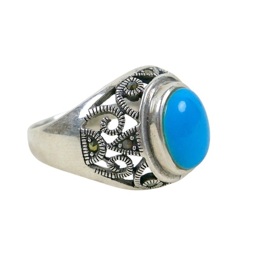 56 - A silver/white metal turquoise ring head size 13 by 16mm, ring size T.