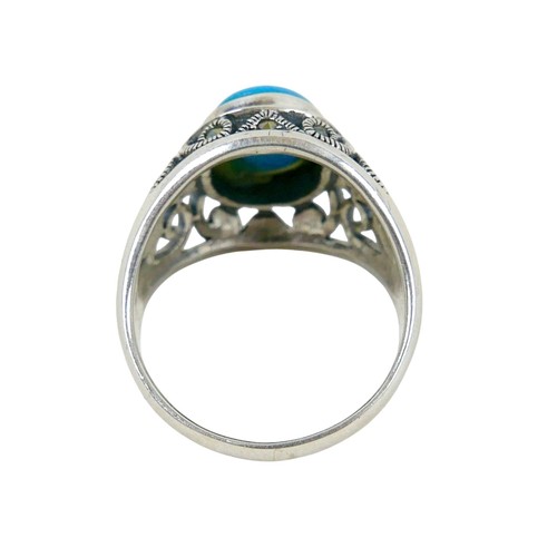 56 - A silver/white metal turquoise ring head size 13 by 16mm, ring size T.