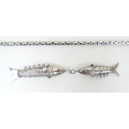 57 - A collection of siver/white metal jewellery and a trinket box comprising six chains, a bracelet, art... 