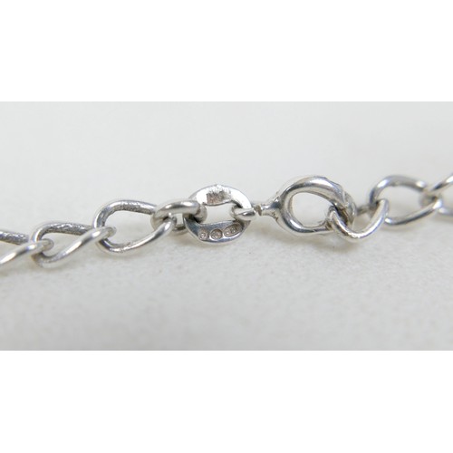57 - A collection of siver/white metal jewellery and a trinket box comprising six chains, a bracelet, art... 