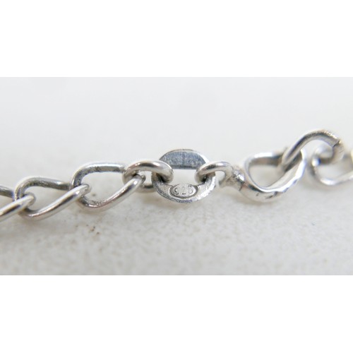 57 - A collection of siver/white metal jewellery and a trinket box comprising six chains, a bracelet, art... 
