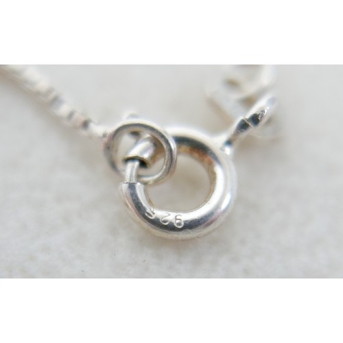57 - A collection of siver/white metal jewellery and a trinket box comprising six chains, a bracelet, art... 