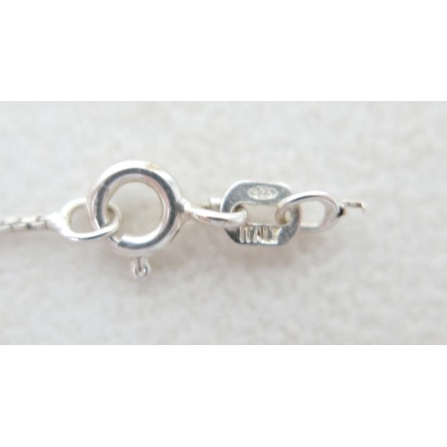 57 - A collection of siver/white metal jewellery and a trinket box comprising six chains, a bracelet, art... 