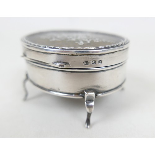 57 - A collection of siver/white metal jewellery and a trinket box comprising six chains, a bracelet, art... 