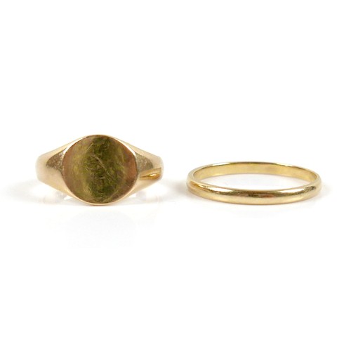 21 - Two 18ct yellow gold rings, comprising a Tiffany & Co band ring, 1.7mm band, size L, and a signet, s... 