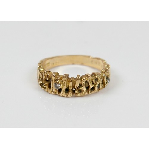 13 - An 18ct yellow gold and diamond ring, with bark texture design, maker RG Ltd, a/f lacking three smal... 