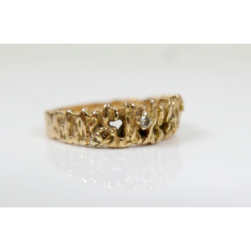 13 - An 18ct yellow gold and diamond ring, with bark texture design, maker RG Ltd, a/f lacking three smal... 