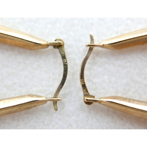12 - A collection of 9ct yellow gold and gilt metal jewellery including brooches, earrings, a signet ring... 