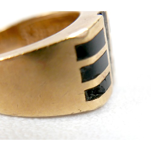 7 - An 18ct yellow gold diamond and black stone ring set with a central row of six small diamonds, ring ... 