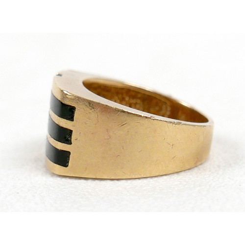 7 - An 18ct yellow gold diamond and black stone ring set with a central row of six small diamonds, ring ... 