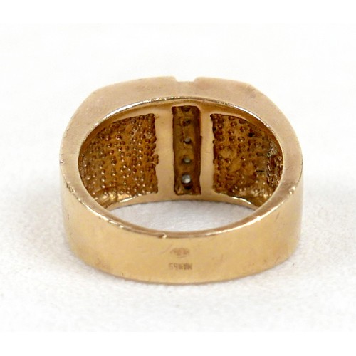 7 - An 18ct yellow gold diamond and black stone ring set with a central row of six small diamonds, ring ... 