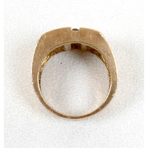7 - An 18ct yellow gold diamond and black stone ring set with a central row of six small diamonds, ring ... 