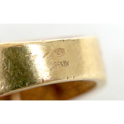 7 - An 18ct yellow gold diamond and black stone ring set with a central row of six small diamonds, ring ... 