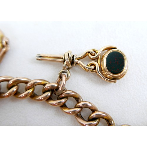 6 - A 9ct gold kerb link charm bracelet, with heart shaped padlock clasp and safety chain, fitted with f... 