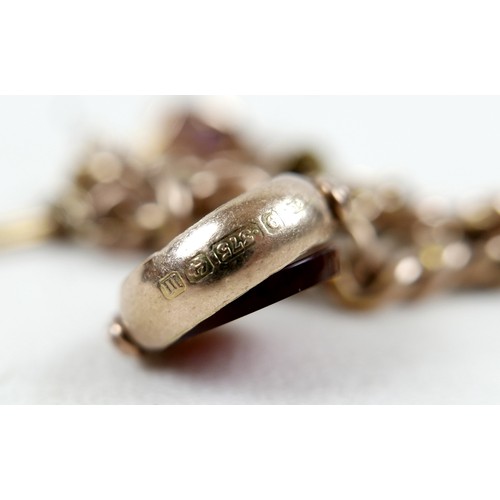 6 - A 9ct gold kerb link charm bracelet, with heart shaped padlock clasp and safety chain, fitted with f... 