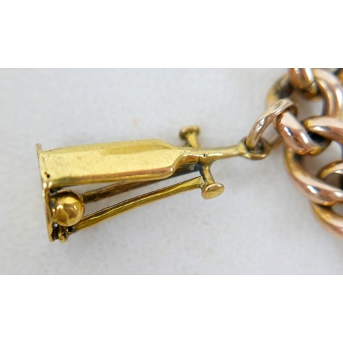 6 - A 9ct gold kerb link charm bracelet, with heart shaped padlock clasp and safety chain, fitted with f... 