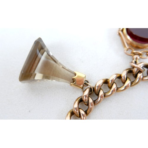 6 - A 9ct gold kerb link charm bracelet, with heart shaped padlock clasp and safety chain, fitted with f... 