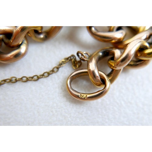 6 - A 9ct gold kerb link charm bracelet, with heart shaped padlock clasp and safety chain, fitted with f... 