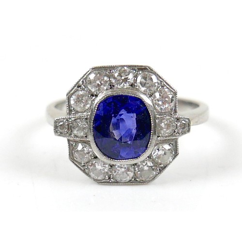 5 - An 18ct white gold, platinum, sapphire and diamond ring, the central oval cut sapphire approximately... 