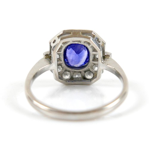 5 - An 18ct white gold, platinum, sapphire and diamond ring, the central oval cut sapphire approximately... 