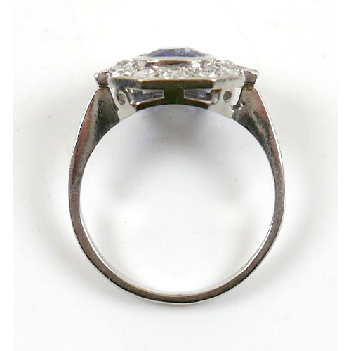 5 - An 18ct white gold, platinum, sapphire and diamond ring, the central oval cut sapphire approximately... 