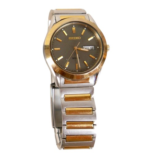 99 - A  Seiko Solar stainless steel and gold plated wristwatch, 36mm case, black dial with batons and Day... 