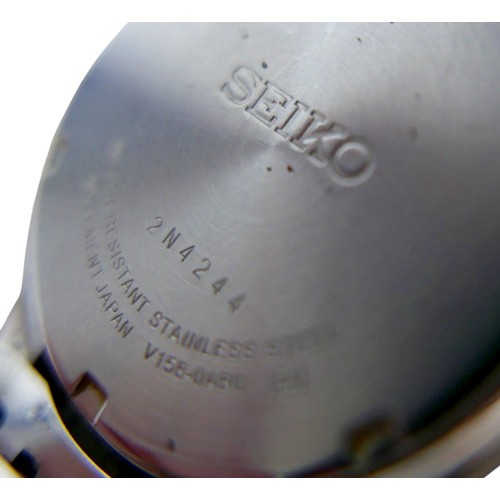 99 - A  Seiko Solar stainless steel and gold plated wristwatch, 36mm case, black dial with batons and Day... 