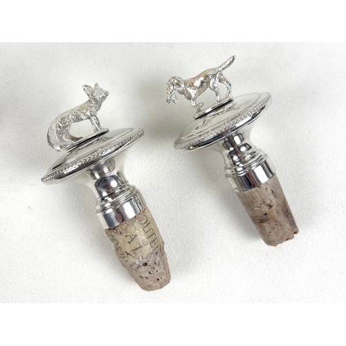 221 - A leather riding crop, with antler handle and silver collar, together with a silver plated Corinthia... 