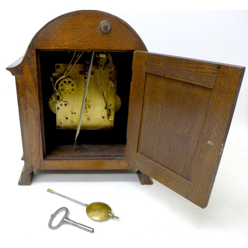 272 - An oak chiming mantle clock with Gustav Becker movement chiming on six rods, 26 by 17 by 32cm high.