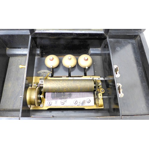 259 - A late Victorian music box with a Swiss barrel movement playing eight airs on three bells, in a simu... 