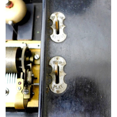 259 - A late Victorian music box with a Swiss barrel movement playing eight airs on three bells, in a simu... 