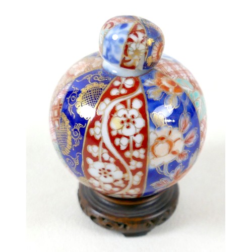 297 - A Chinese soapstone group on stand, a miniature Imari pattern ginger jar, a/f cover damaged, and a y... 