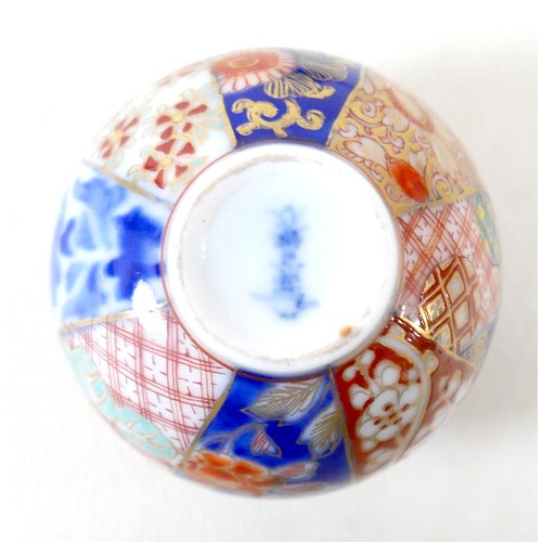 297 - A Chinese soapstone group on stand, a miniature Imari pattern ginger jar, a/f cover damaged, and a y... 
