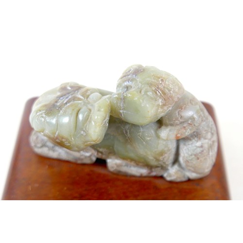 297 - A Chinese soapstone group on stand, a miniature Imari pattern ginger jar, a/f cover damaged, and a y... 