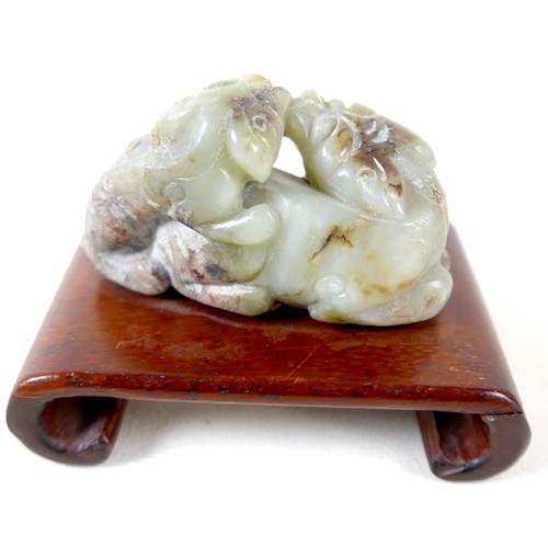 297 - A Chinese soapstone group on stand, a miniature Imari pattern ginger jar, a/f cover damaged, and a y... 
